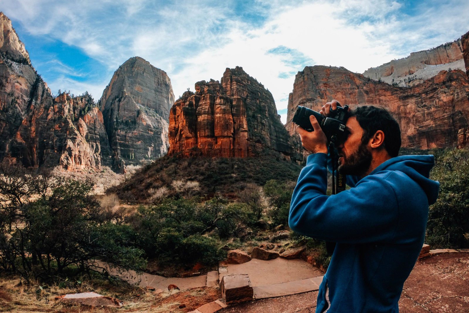 Man points his camera in Zion National Park