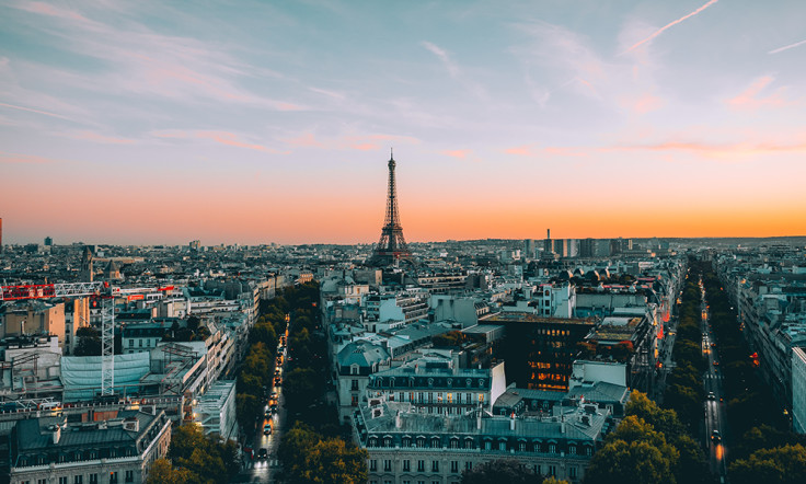 city view of Paris France at sunset with orange and pink sky