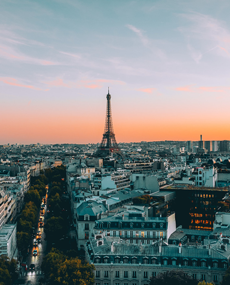 city view of Paris France at sunset with orange and pink sky