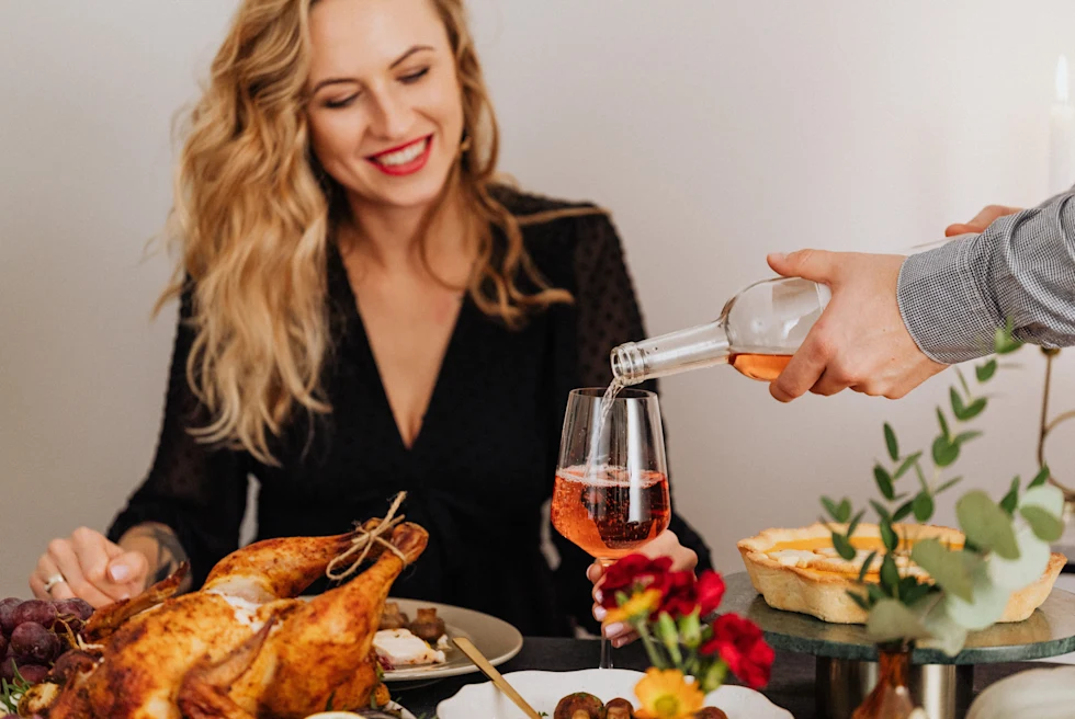 A girl filling her glass with drink