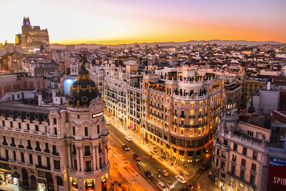 Aerial view of buildings and streets during sunset