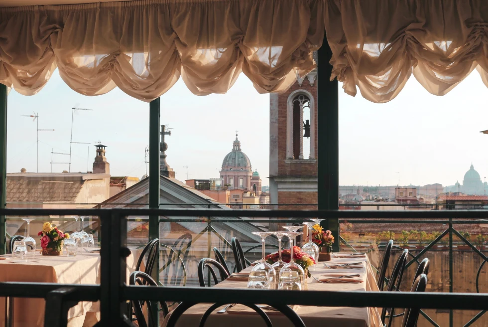 A table overlooking the rooftops of Rome. 
