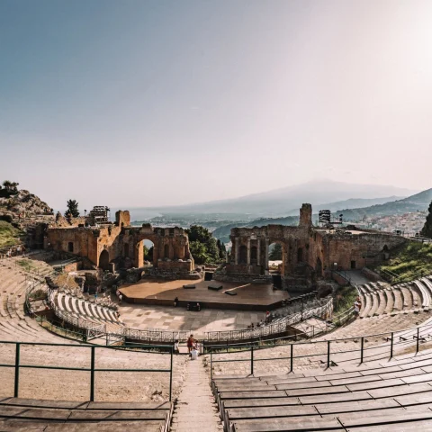 ancient ruins in a circular theatre overlooking the Mediterranean