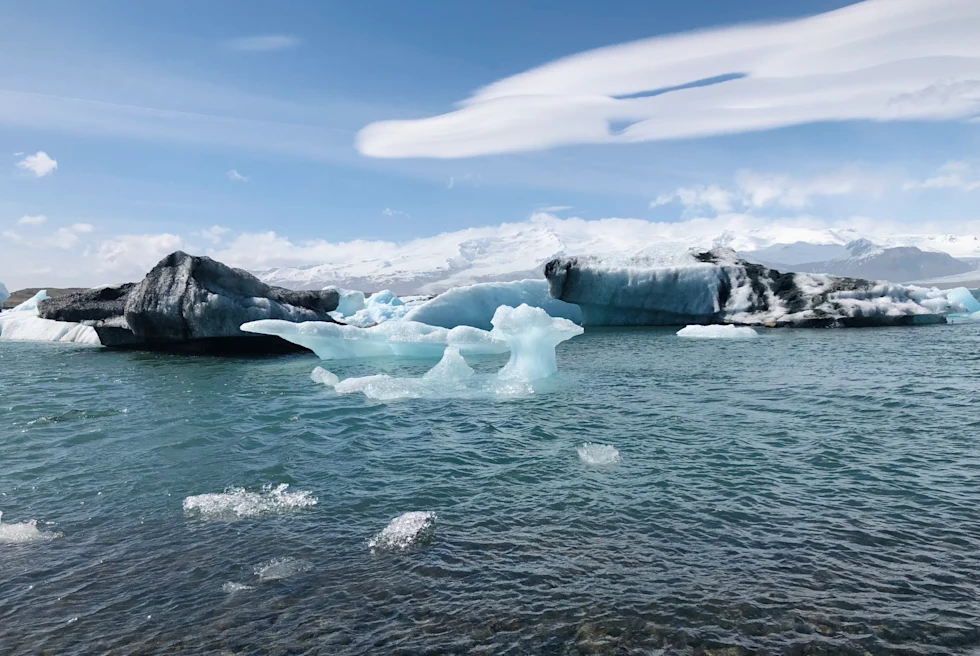 Frozen glaciers with lake water.