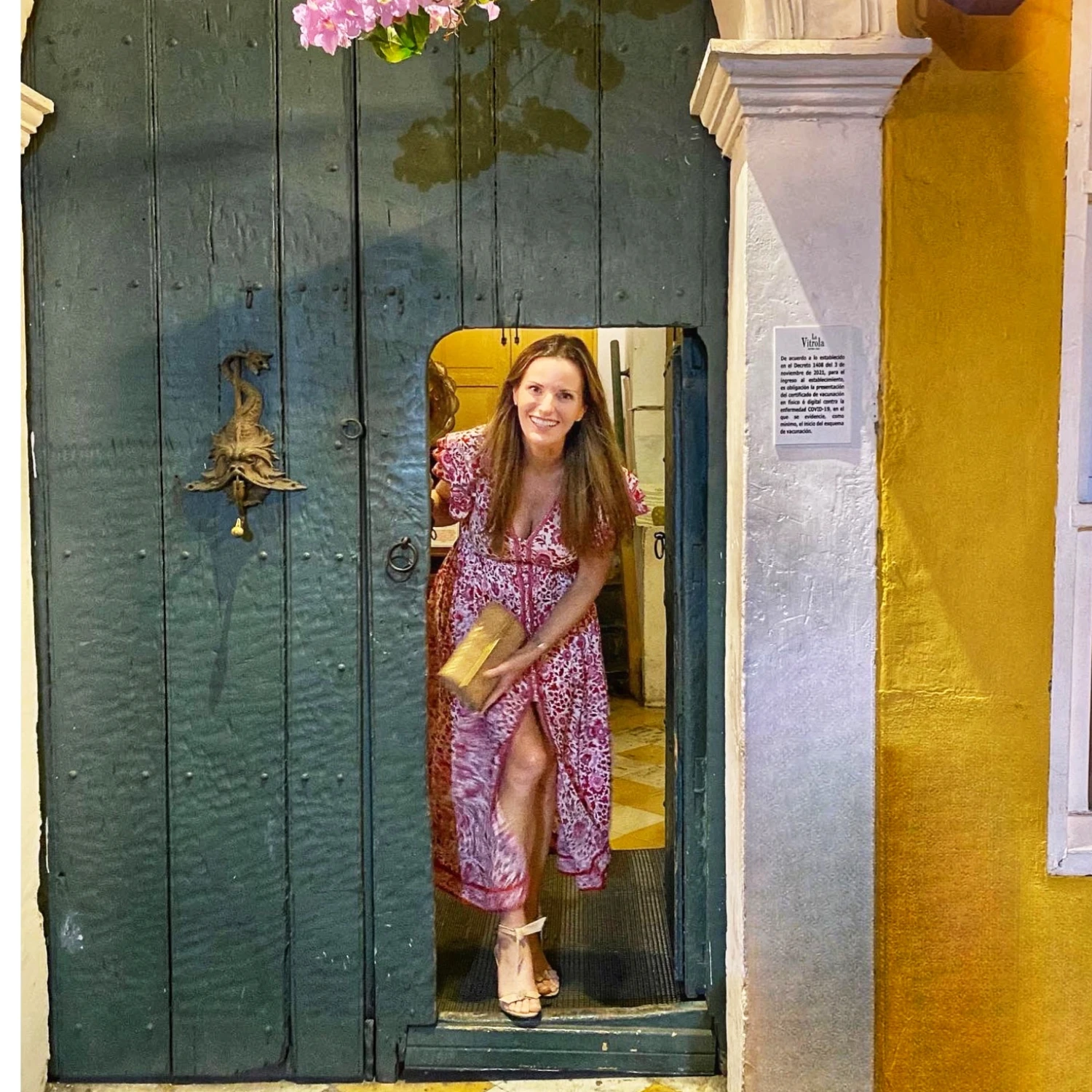 Travel advisor posing in a green doorway