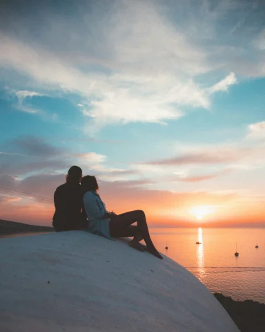 A romantic moment of a couple in Santorini.