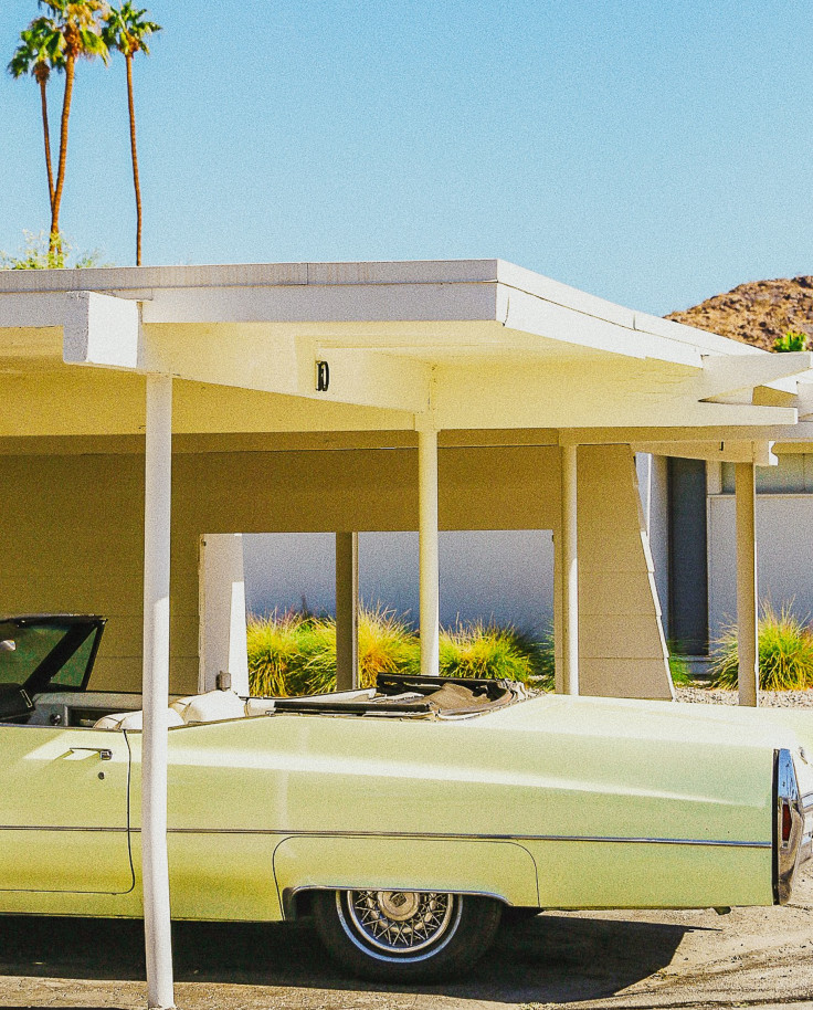 Yellow mid-century house and lime green vintage car in Palm Springs. 