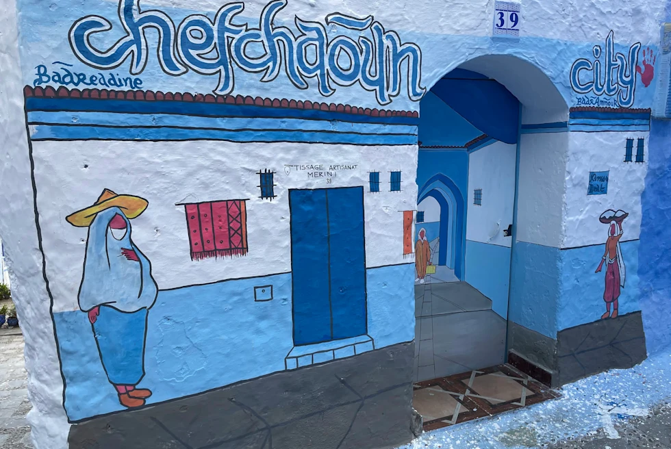 Blue and white city walls with drawings