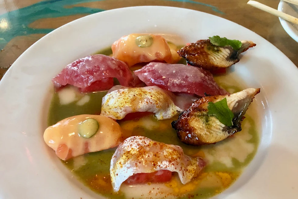 plate of tacos on a blue table