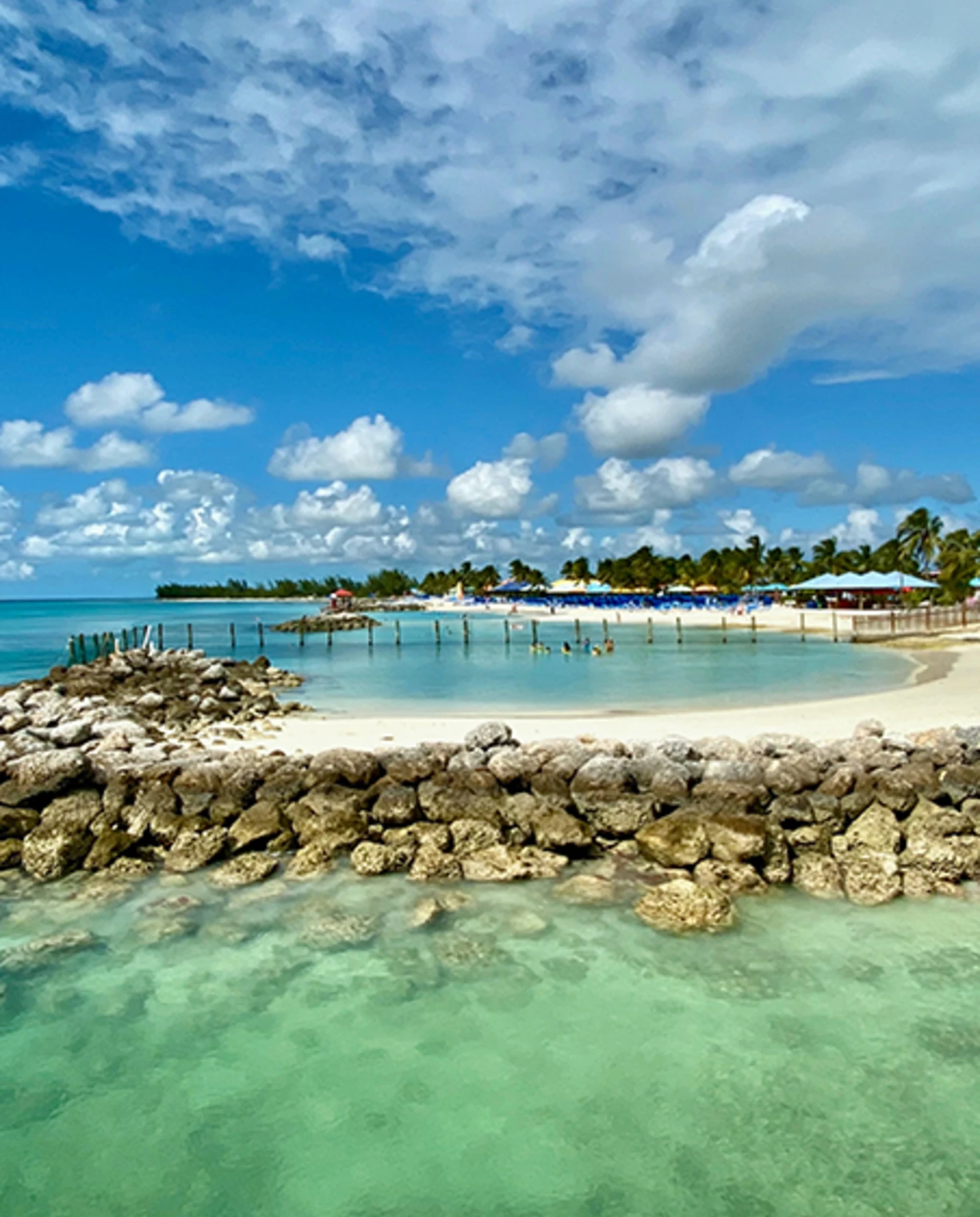 White sand beach with cabanas In Harbor Island, Bahamas.