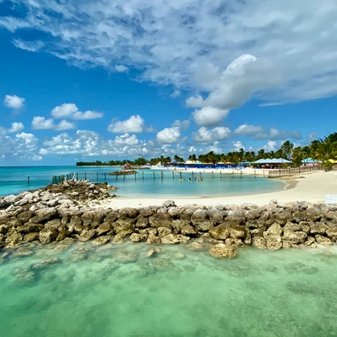 White sand beach with cabanas In Harbor Island, Bahamas.