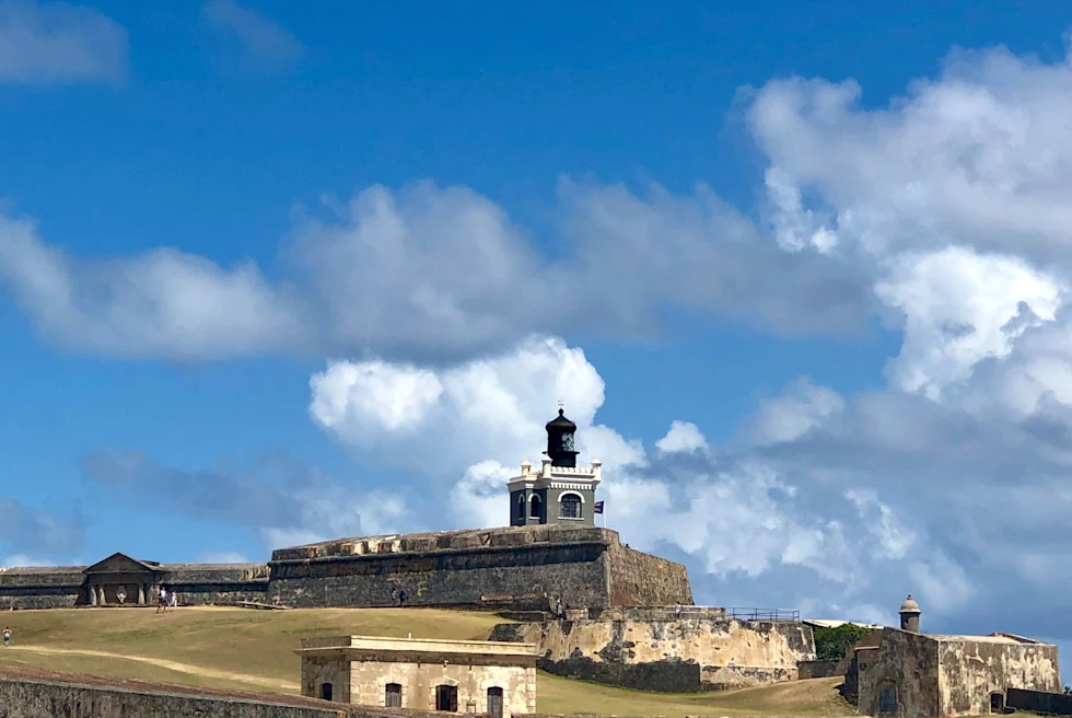 Buildings on top of grass field during daytime