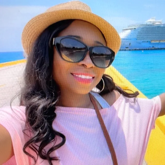 Travel advisor Shira Smith in front of a cruise ship.