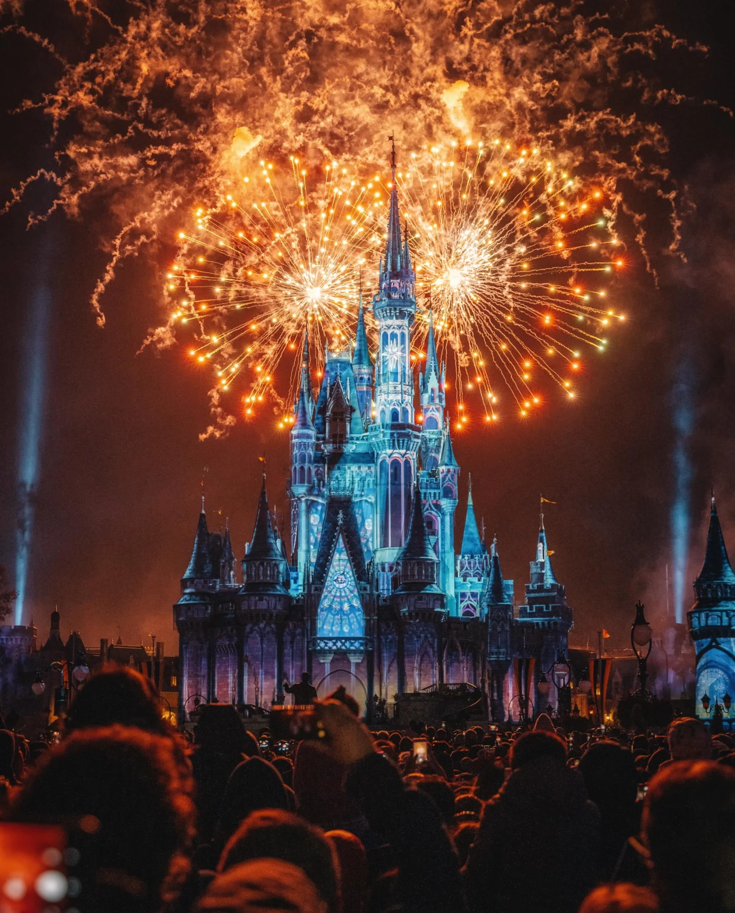 fireworks behind a Disney castle