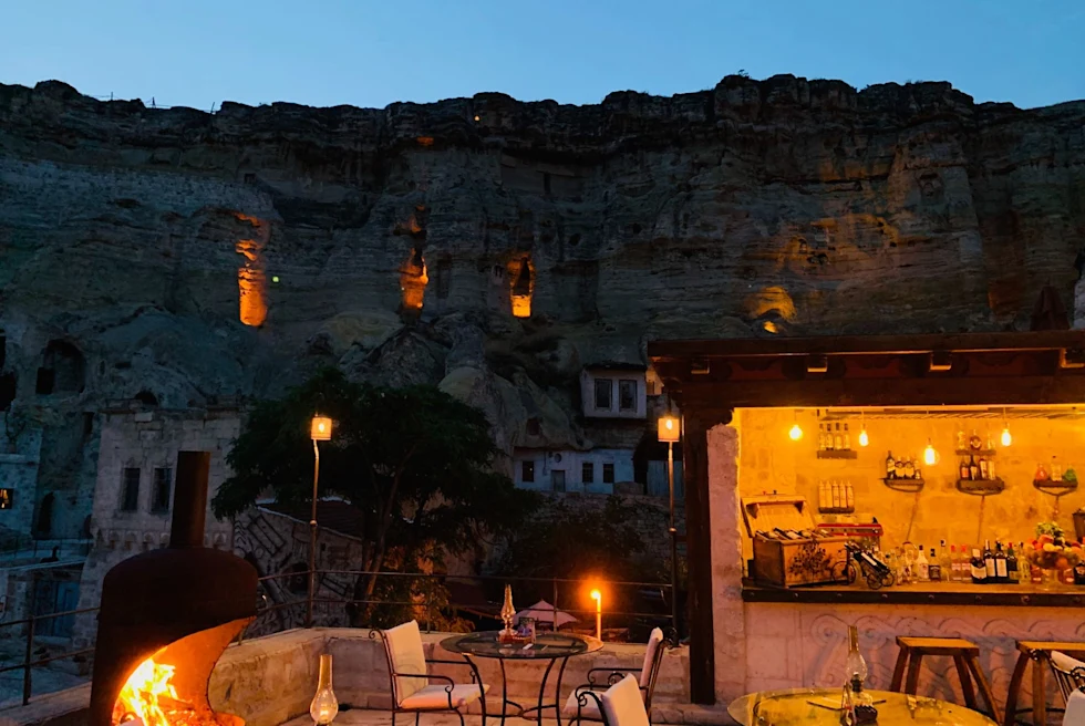 rooftop restaurant at night set in a cave