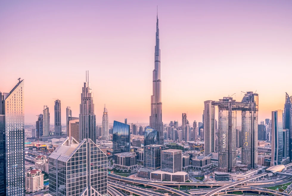 Burj Khalifa and the Dubai skyline at sunrise. 