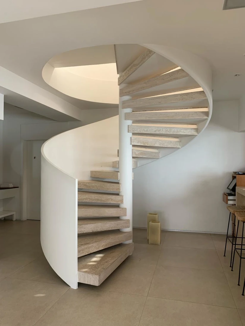 White and wooden spiral staircase in hotel