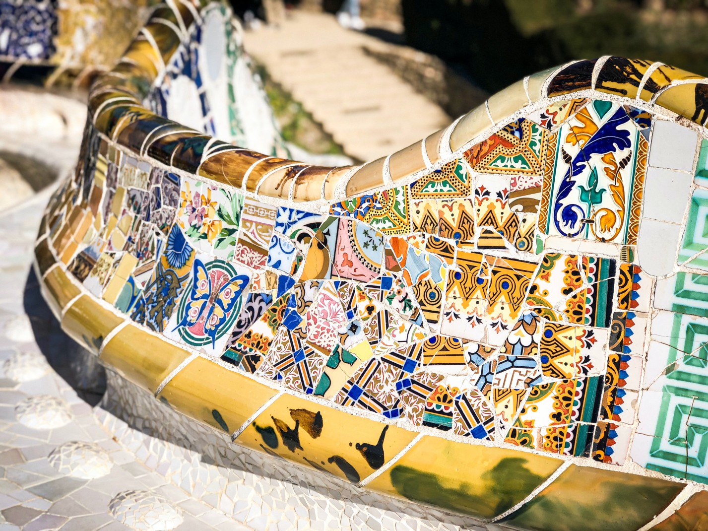 Colorful tiles on a bench at Park Guell in Barcelona, Spain.