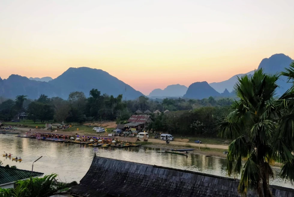 A river with mountains at the back. 