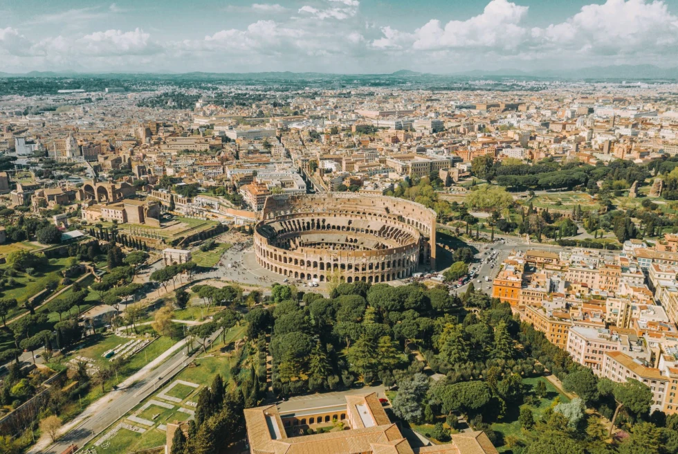 birds eye view of a ancient city with a central Colosseum