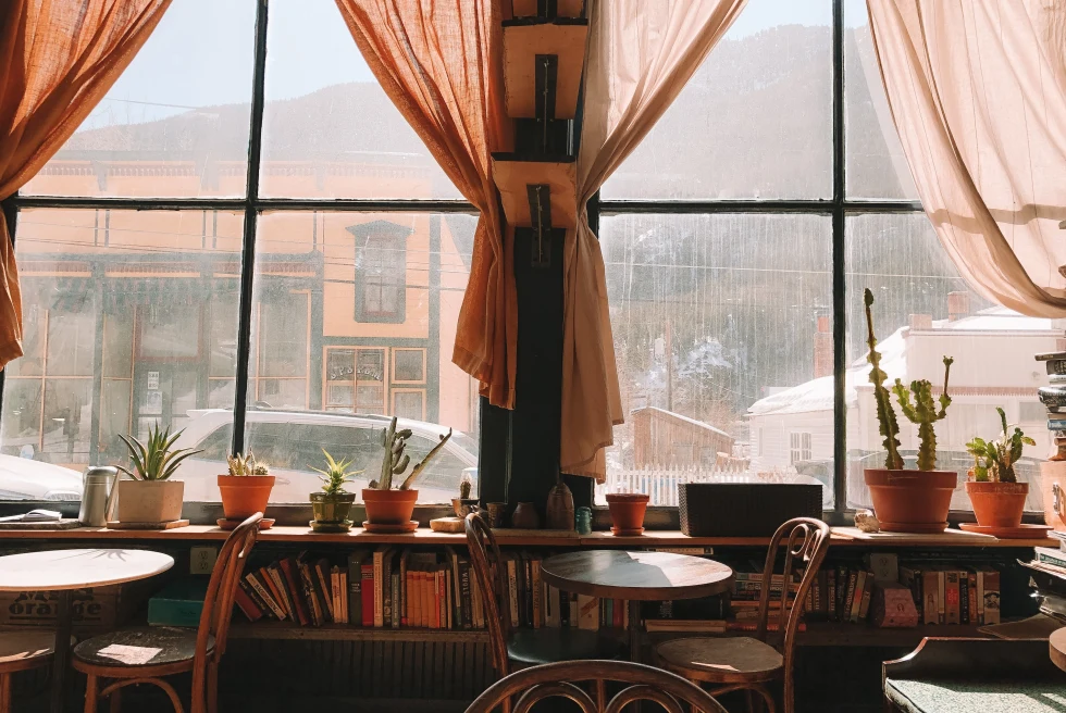 Brown Wooden Table and Chairs Near Window
