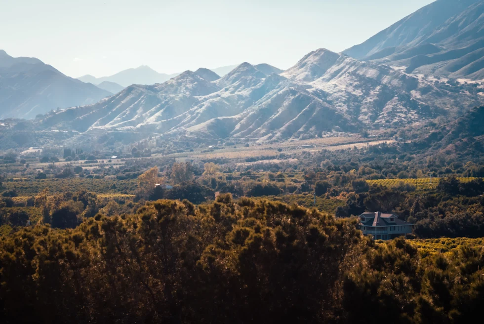 An aerial mountain view over a valley in California.