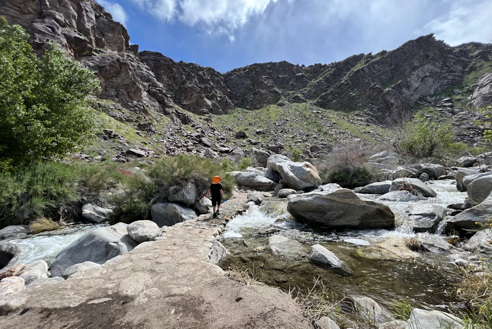 large rocks surrounded by mountains during daytime