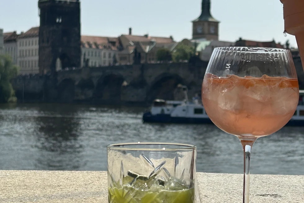 Two cocktails with the views of Prague behind.