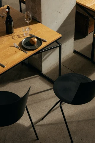 aerial view of a black stool near a wooden table