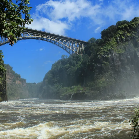 A bridge over a river with a waterfall