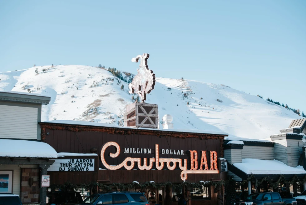 Cowboy Bar in front of a snow-covered hill