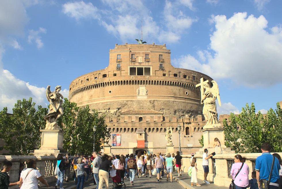 people standing in front of large building during daytime