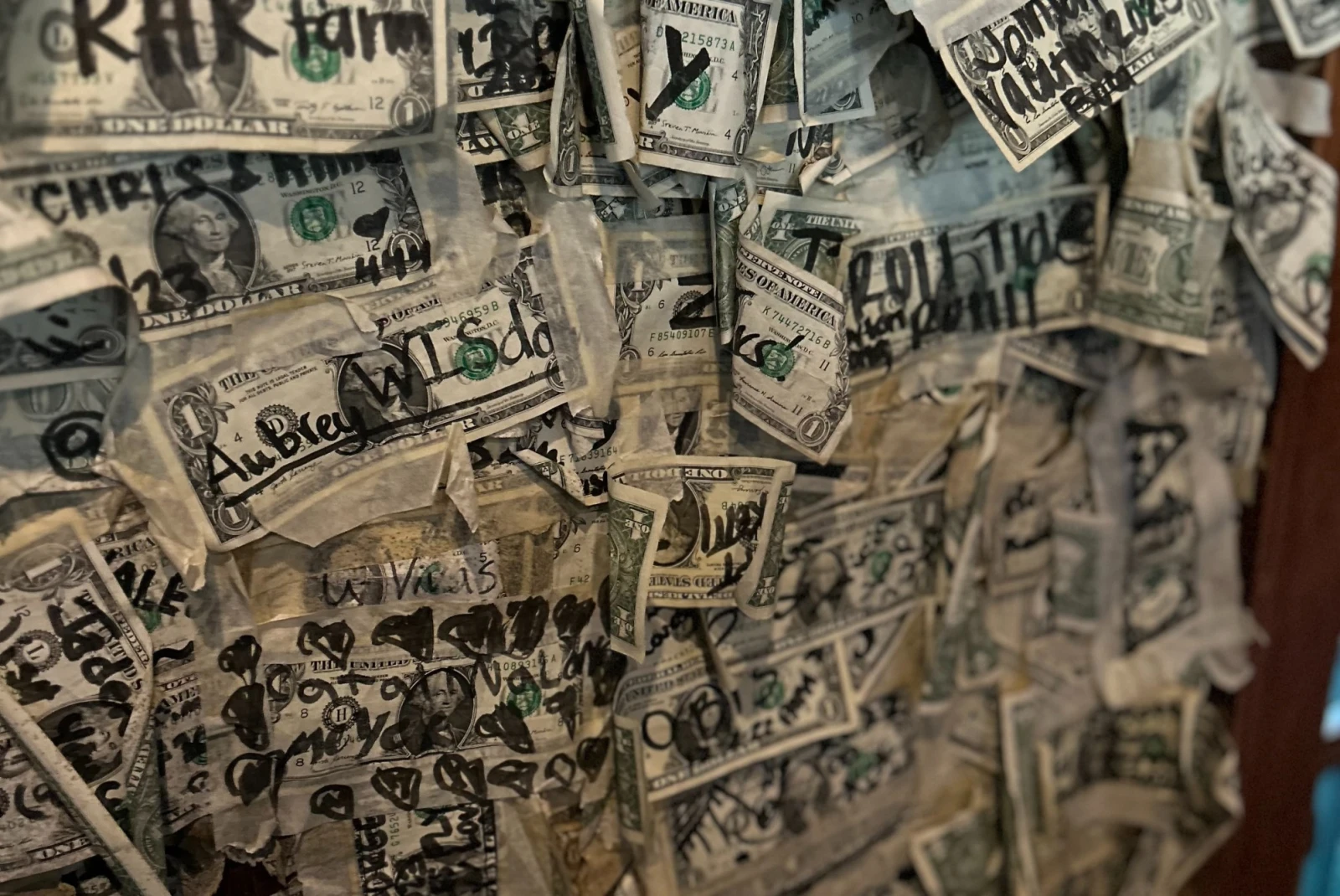 A wall with dollar bills, 