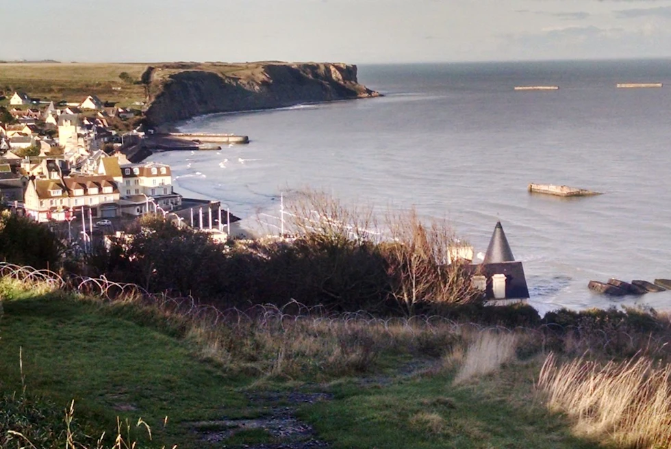 Ocean and coastline with white houses and boats