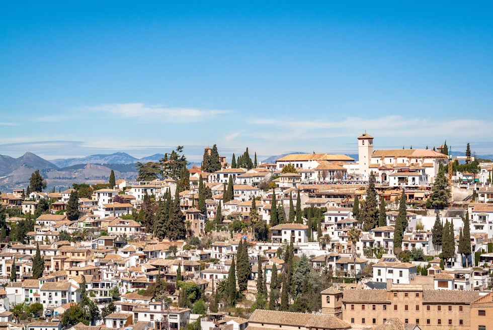 buildings on a cliffside during daytime