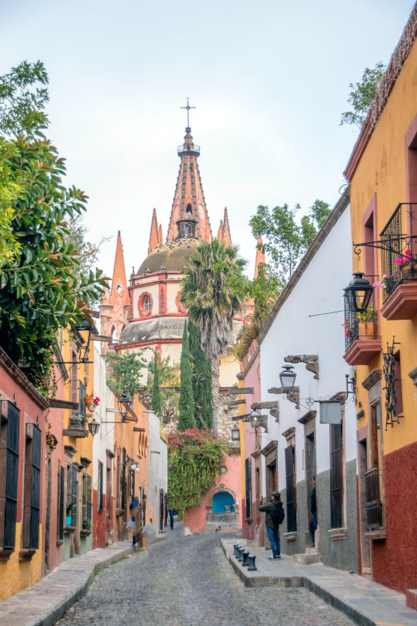 View of street, church and colorful buildings in San Miguel Allende