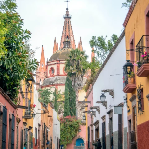 View of street, church and colorful buildings in San Miguel Allende