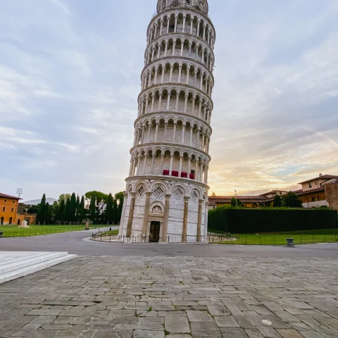 A low-angled shot of the famous Pisa Tower, taken during daytime.
