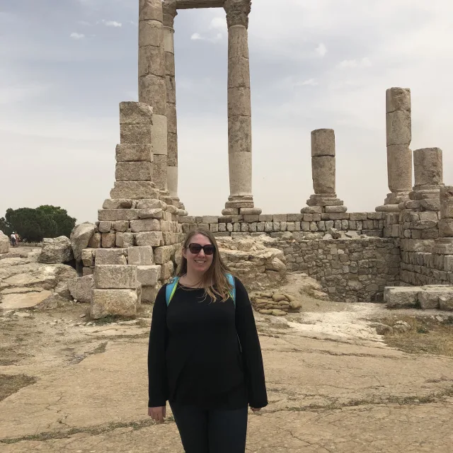 Travel advisor Katherine Daniels in front of ancient ruins