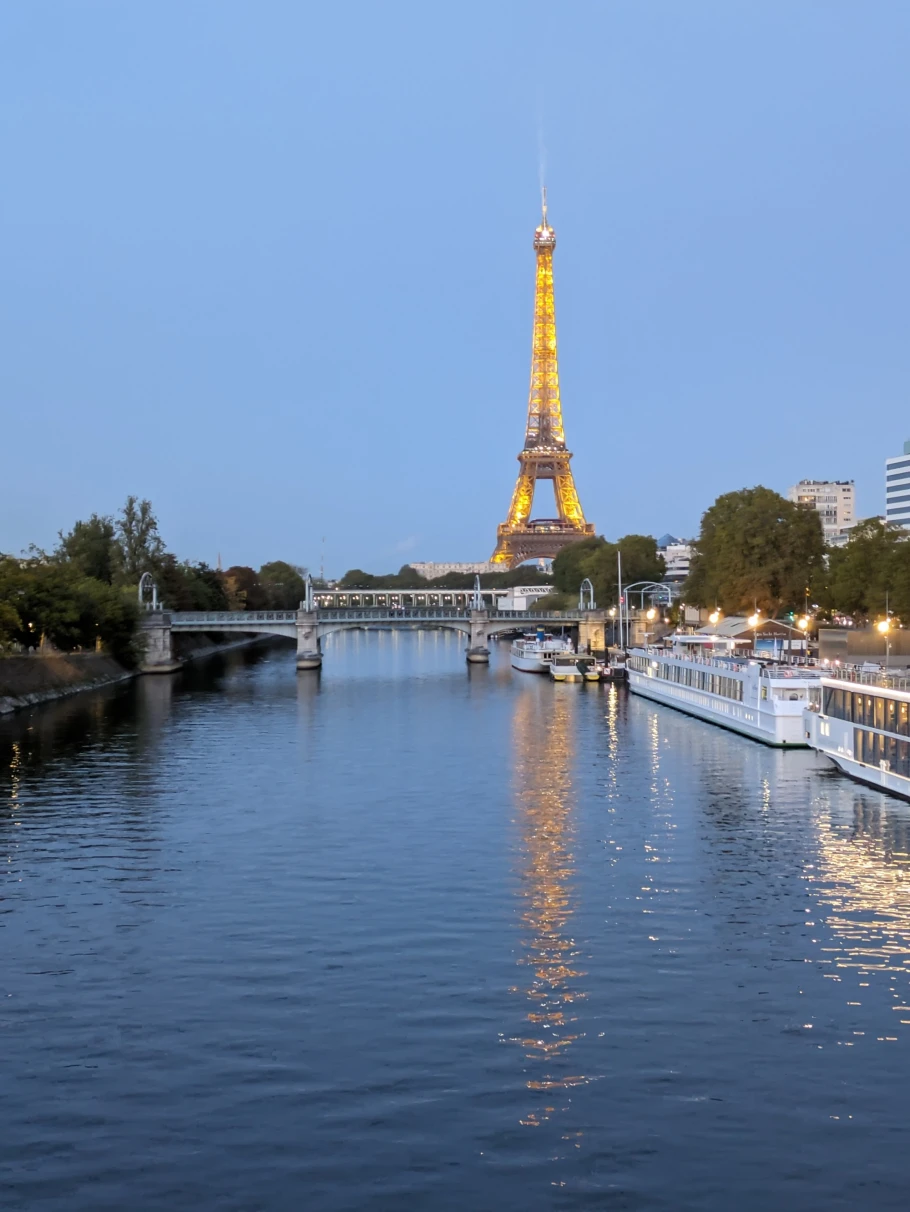 View of Eiffel tower and city canal. 