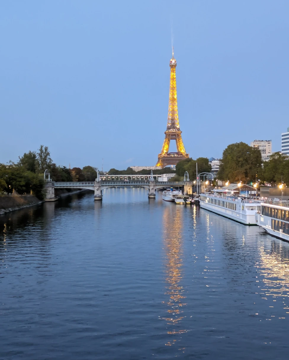 View of Eiffel tower and city canal. 