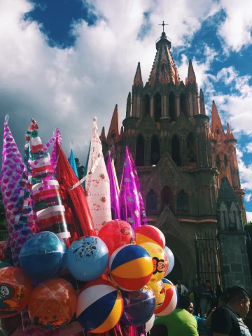 Colorful balloons with church at the background. 