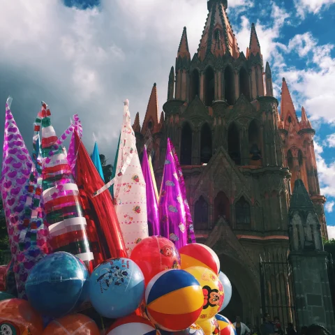 Colorful balloons with church at the background. 