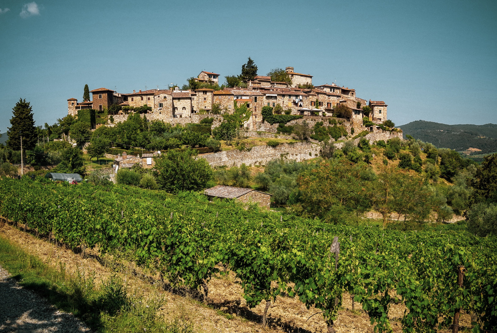 large building perched on hill during daytime