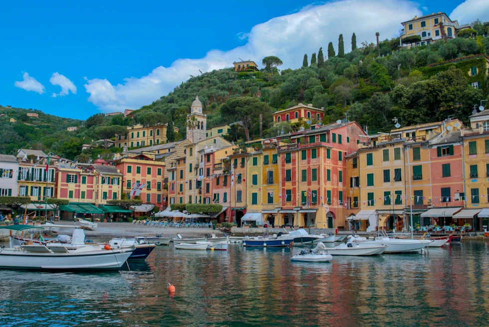 the harbor of a colorful coastal town on a sunny day