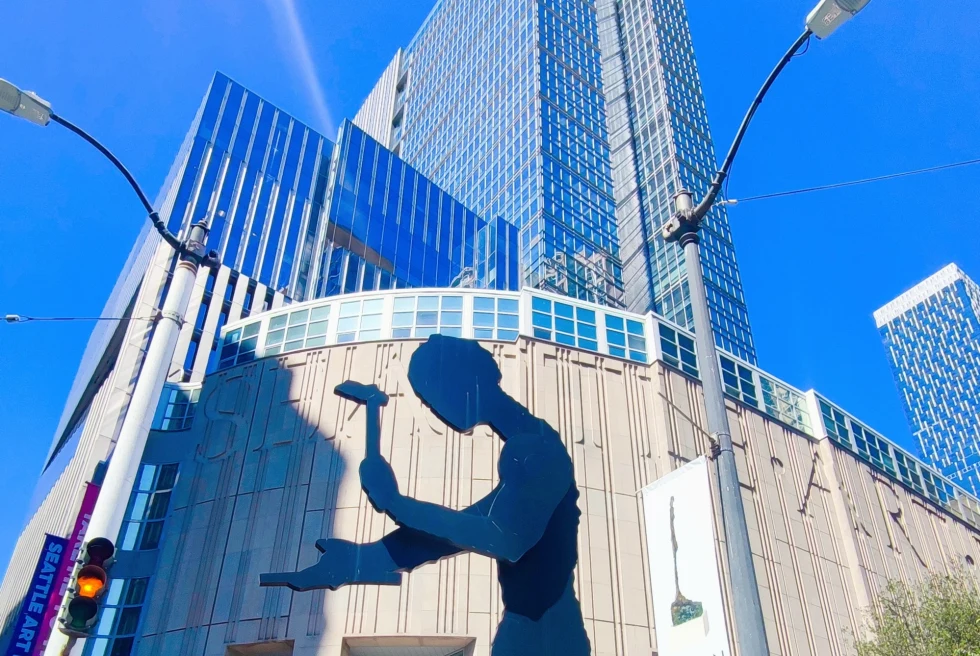modern building with a shadow of man's figure across the facade