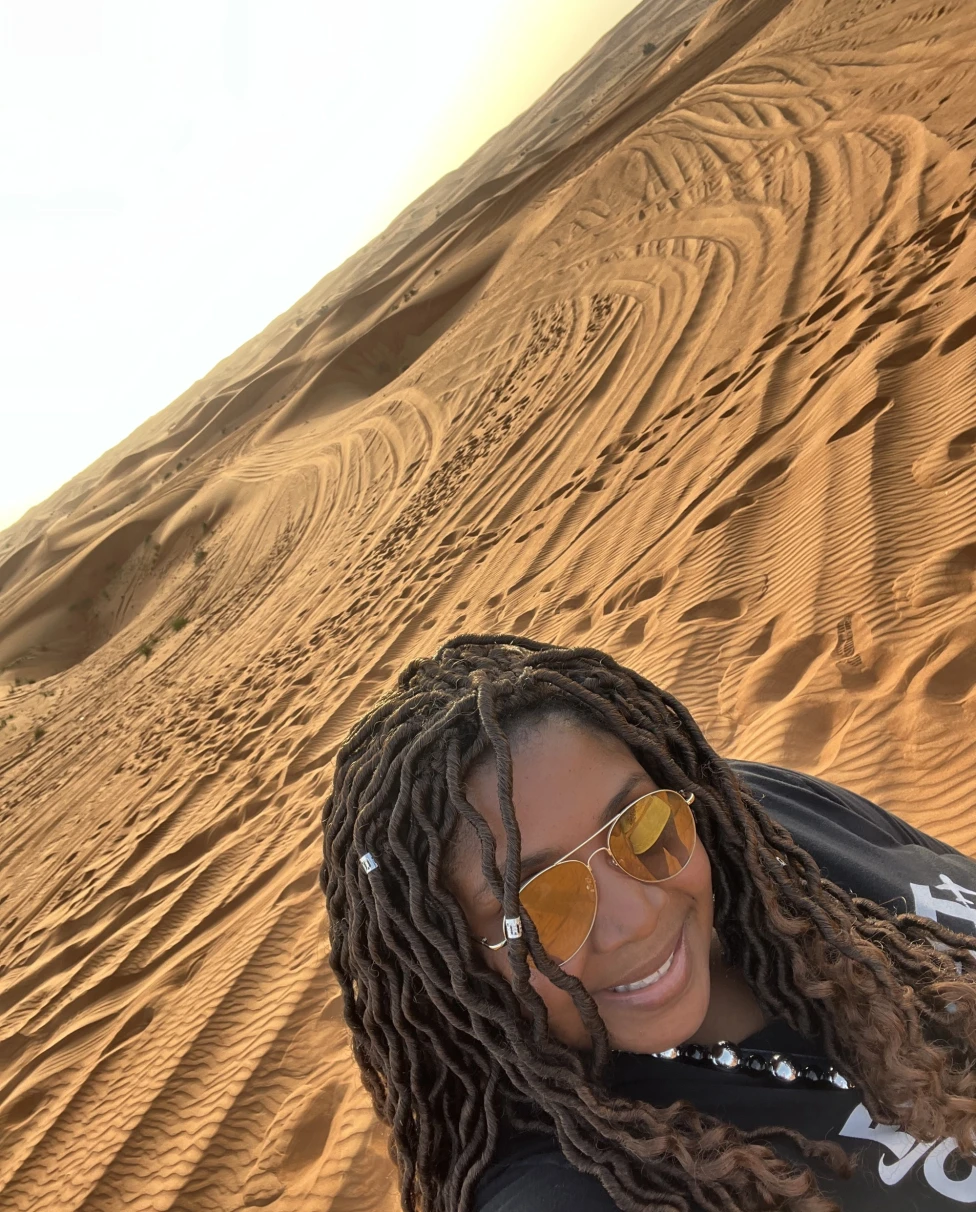 Woman taking a selfie in a desert. 