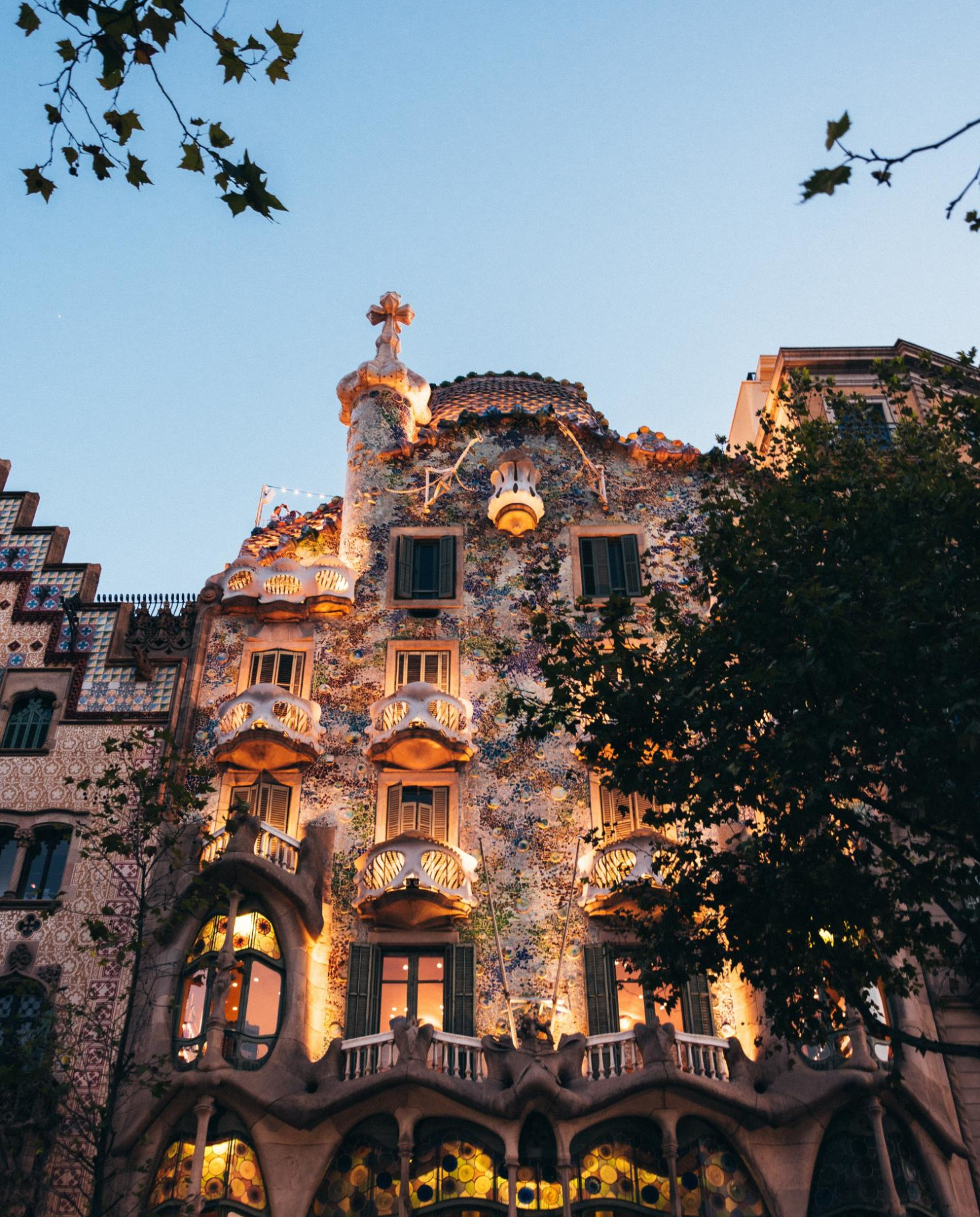 Antoni Gaudi's building in Barcelona at lit up at night.