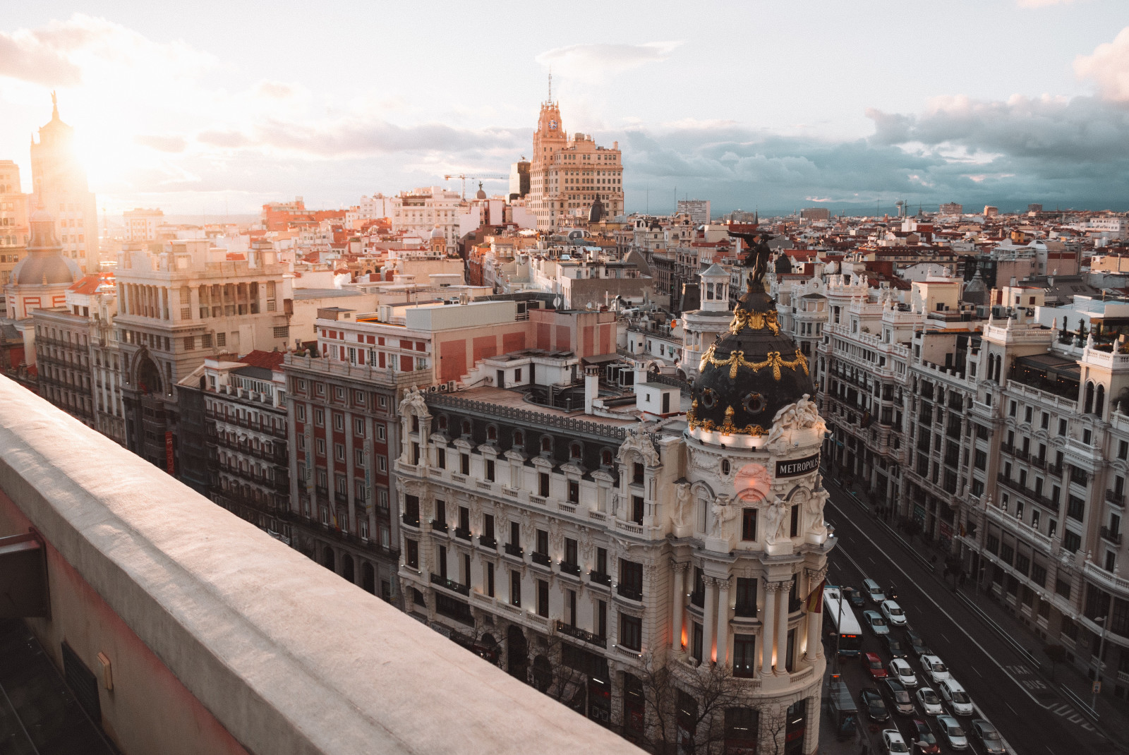 Rooftop overlooking buildings and streets of Madrid, Spain at sunset