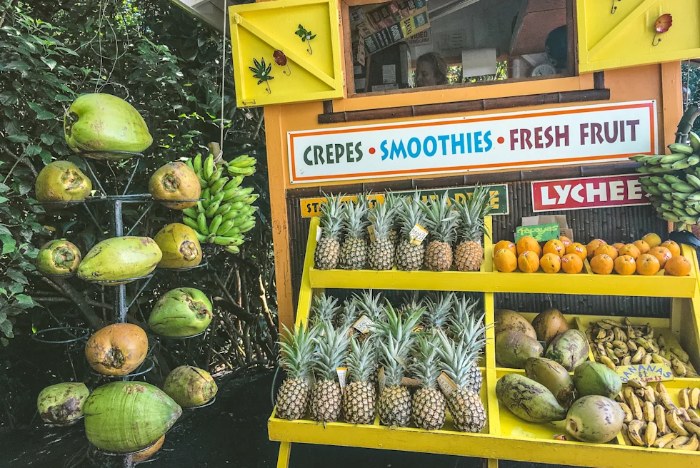 Fruits on a wood stand during daytime